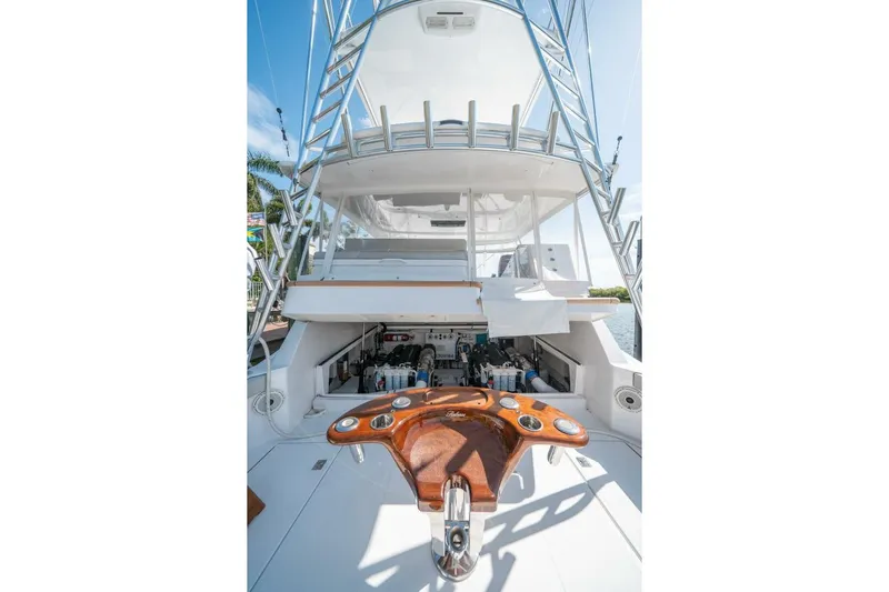 Big Hit Yacht Photos Pics 2020 Cabo 40 Express yacht with fishing cockpit and ladder, docked under clear skies.