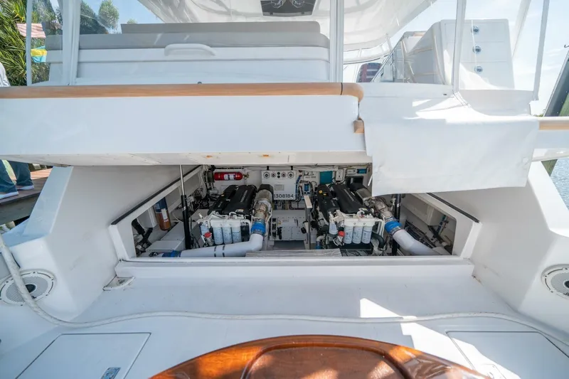 Big Hit Yacht Photos Pics Engine compartment of 2020 Cabo 40 Express yacht, showcasing detailed mechanical components.