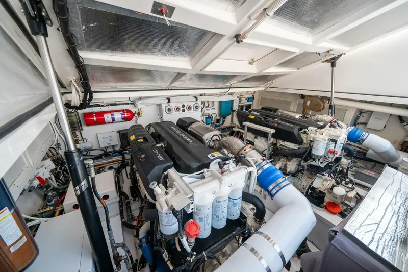 Big Hit Yacht Photos Pics Engine room of 2020 Cabo 40 Express yacht, featuring dual engines and equipment.