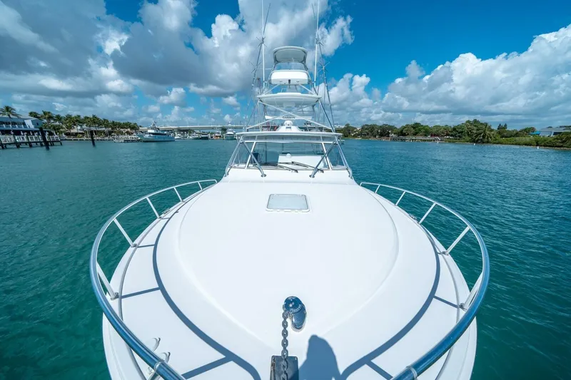 Big Hit Yacht Photos Pics Cabo 40 Express 2020 yacht on clear blue water under a vibrant sky.