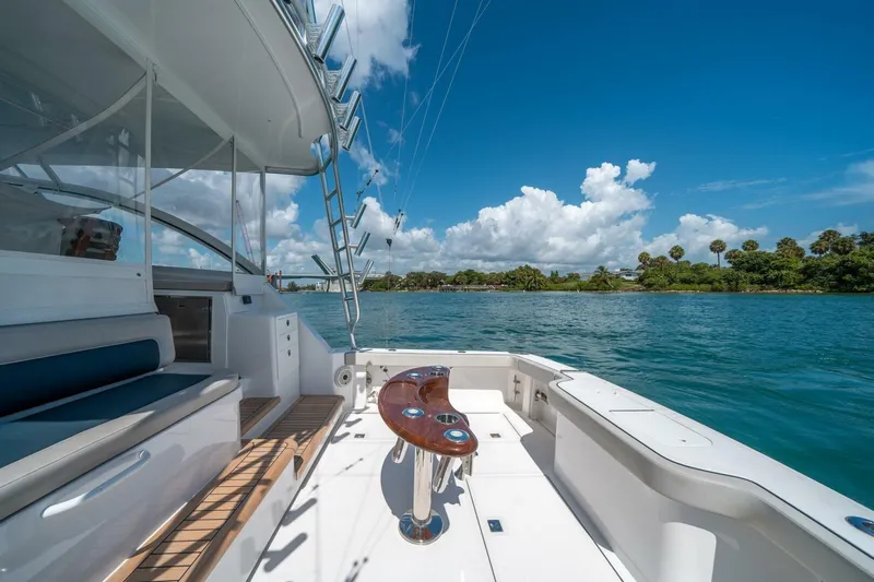 Big Hit Yacht Photos Pics 2020 Cabo 40 Express yacht deck with scenic water view and clear blue sky.