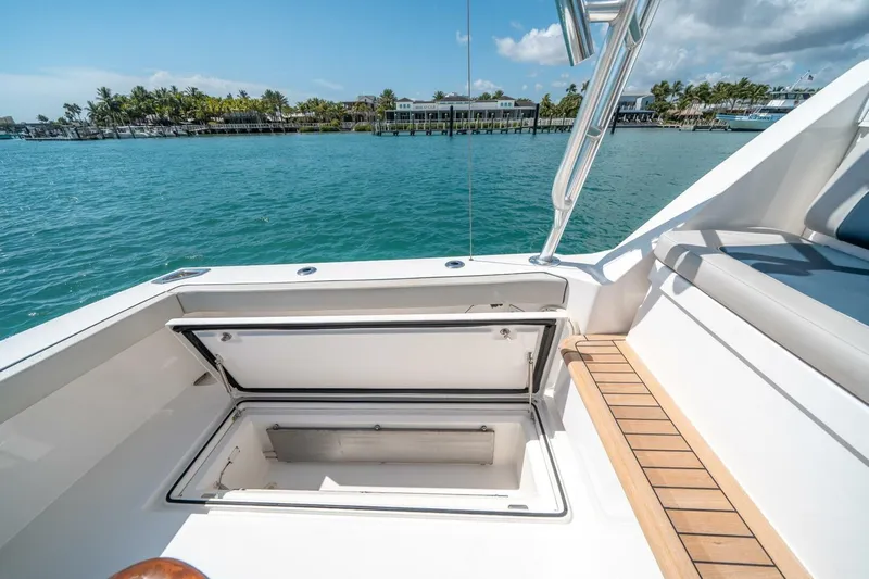Big Hit Yacht Photos Pics 2020 Cabo 40 Express yacht with open storage compartment, dockside view.