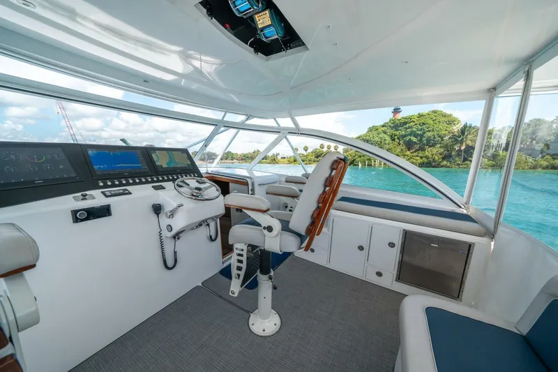Big Hit Yacht Photos Pics Helm of 2020 Cabo 40 Express yacht with scenic ocean view.