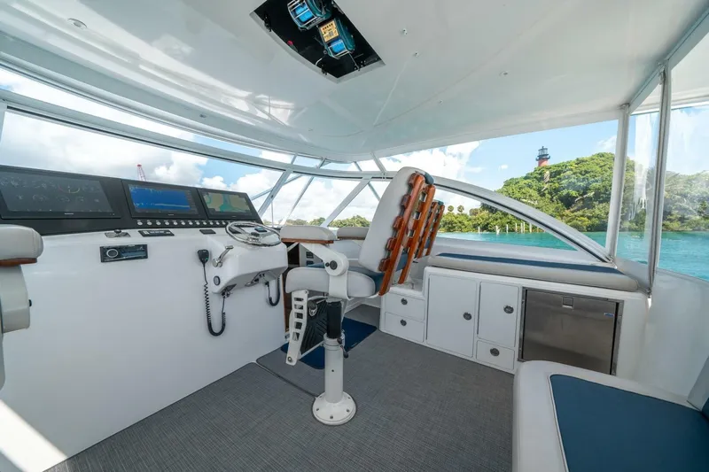 Big Hit Yacht Photos Pics Interior of 2020 Cabo 40 Express yacht with modern helm and scenic ocean view.