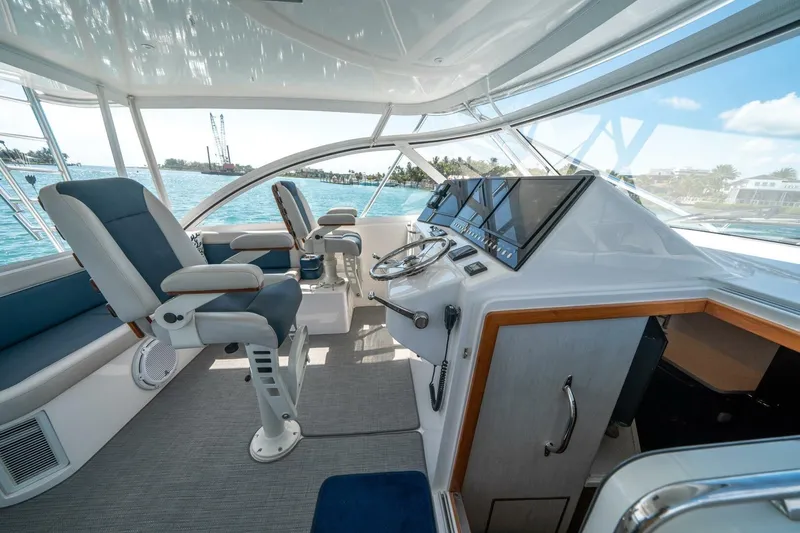 Big Hit Yacht Photos Pics Interior of 2020 Cabo 40 Express yacht with modern helm and seating.