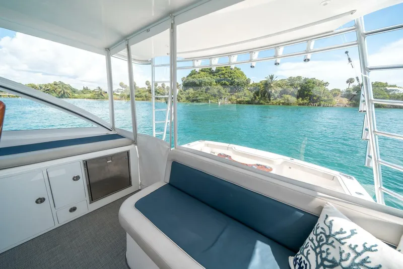 Big Hit Yacht Photos Pics Interior view of 2020 Cabo 40 Express yacht with scenic water backdrop.