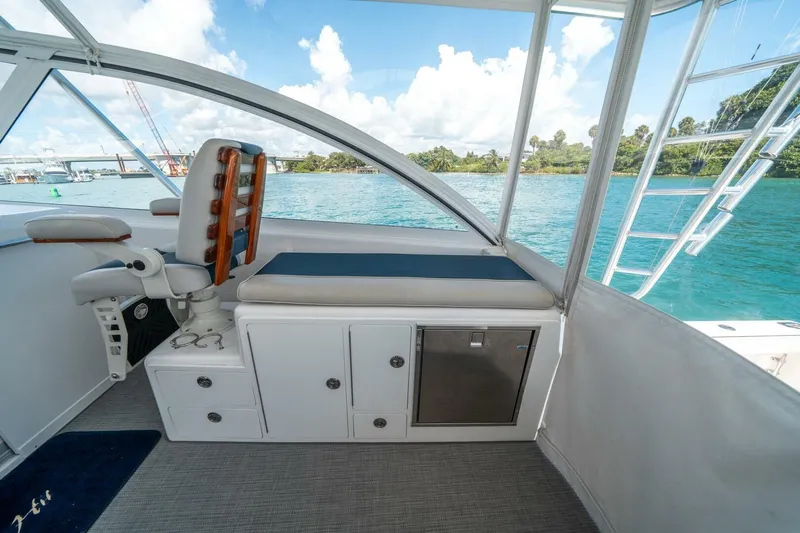 Big Hit Yacht Photos Pics 2020 Cabo 40 Express boat interior with seating, storage, and ocean view.