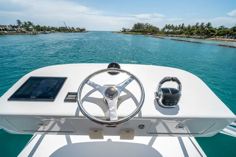 Big Hit Yacht Photos Pics Helm of 2020 Cabo 40 Express yacht with ocean view and clear skies.