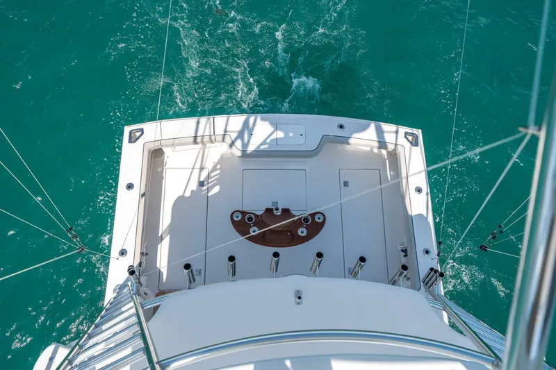 Big Hit Yacht Photos Pics Aerial view of 2020 Cabo 40 Express boat deck on turquoise water.