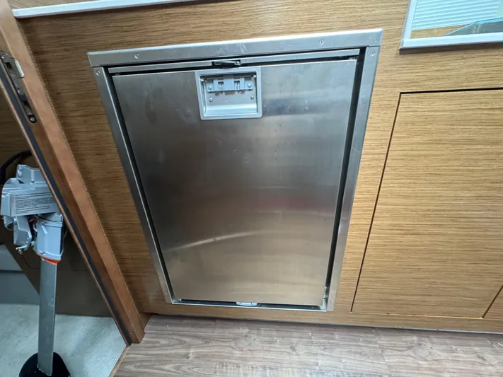 Determination Yacht Photos Pics Stainless steel refrigerator in 2020 Cruisers Yachts 39 Express Coupe interior.