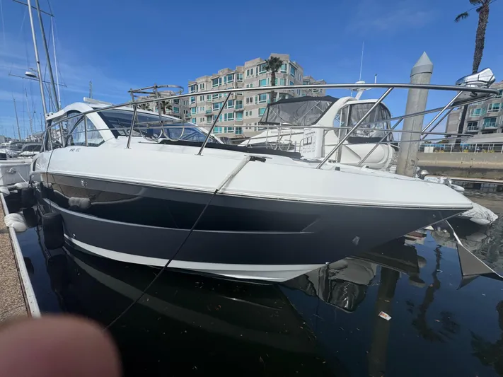 Determination Yacht Photos Pics 2020 Cruisers Yachts 39 Express Coupe docked in marina, clear sky background.