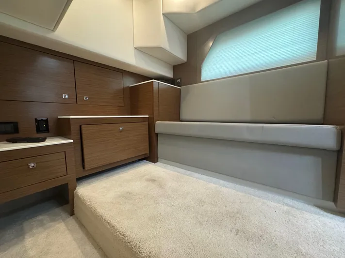 Determination Yacht Photos Pics Interior of 2020 Cruisers Yachts 39 Express Coupe with modern wood cabinetry and seating.