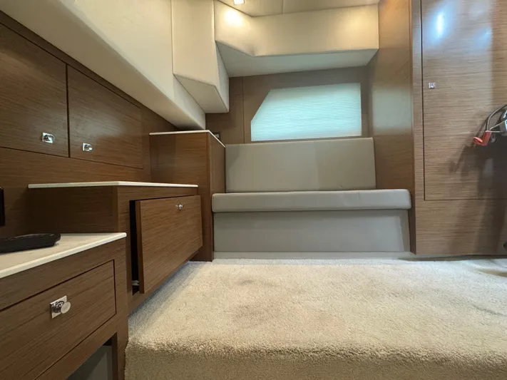 Determination Yacht Photos Pics Interior of 2020 Cruisers Yachts 39 Express Coupe with modern wood cabinetry and seating.