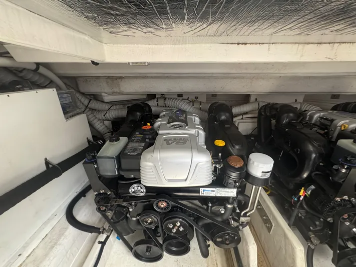 Determination Yacht Photos Pics Engine compartment of 2020 Cruisers Yachts 39 Express Coupe, showcasing detailed mechanical components.