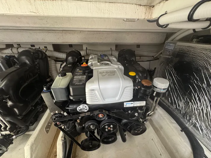 Determination Yacht Photos Pics Engine compartment of 2020 Cruisers Yachts 39 Express Coupe, showcasing detailed mechanical components.