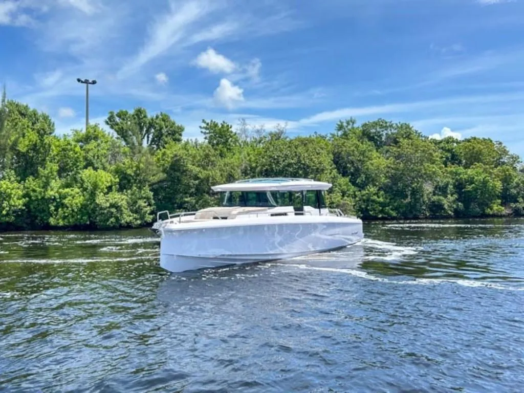 2024 Axopar 45 XC Cross Cabin boat cruising on a sunny day.