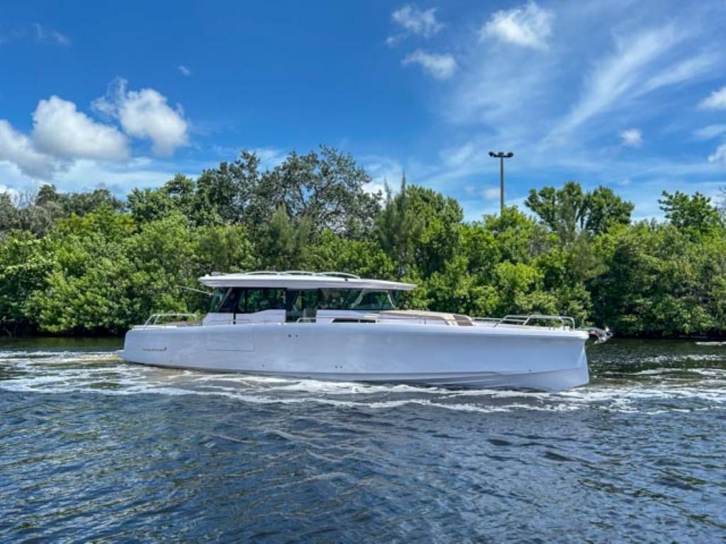 2024 Axopar 45 XC Cross Cabin boat cruising on a sunny day.