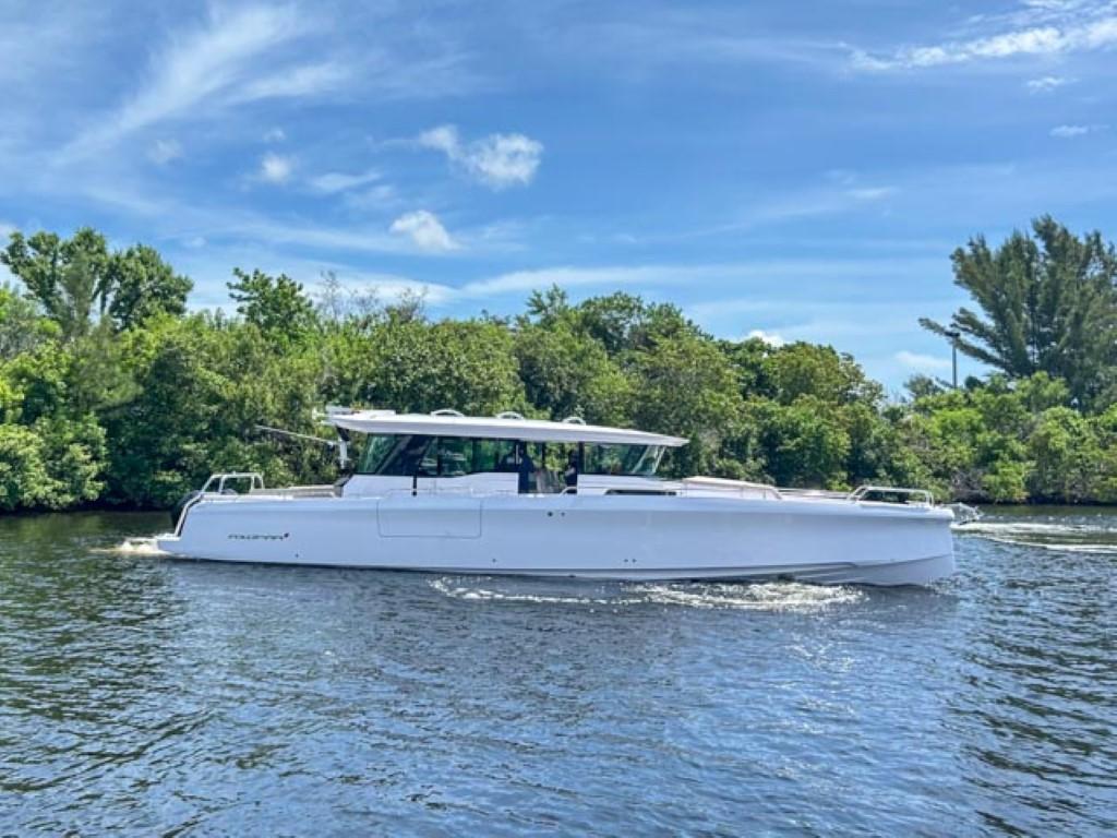 2024 Axopar 45 XC Cross Cabin boat cruising on a sunny day.