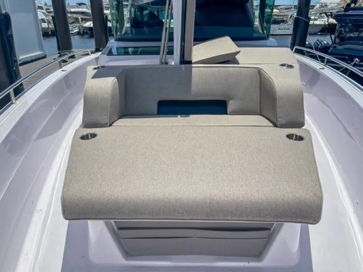  Yacht Photos Pics 2024 Axopar 45 XC Cross Cabin boat interior with cushioned seating.