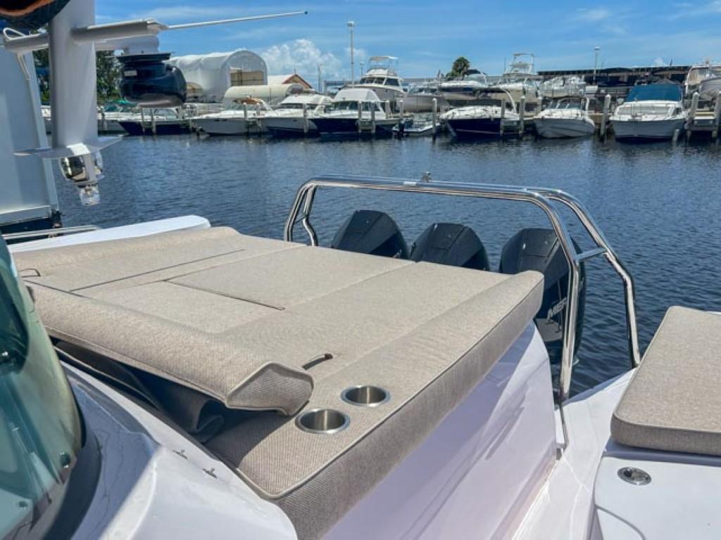 2024 Axopar 45 XC Cross Cabin boat with sun deck and marina view.