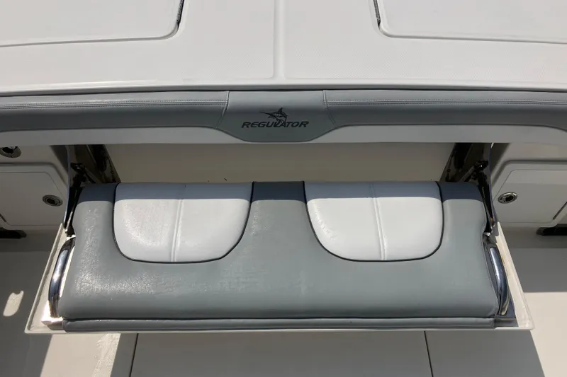  Yacht Photos Pics 2020 Regulator 31 boat seat with gray and white cushioned design.