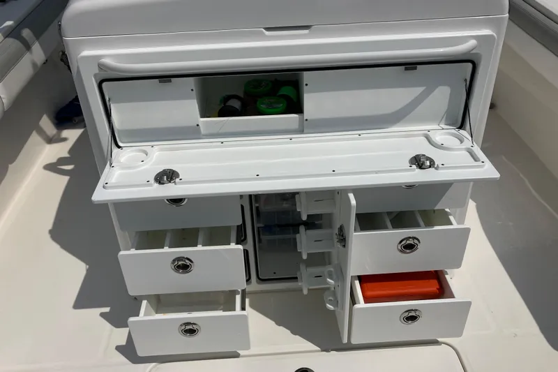  Yacht Photos Pics 2020 Regulator 31 boat storage compartment with open drawers and tackle storage.