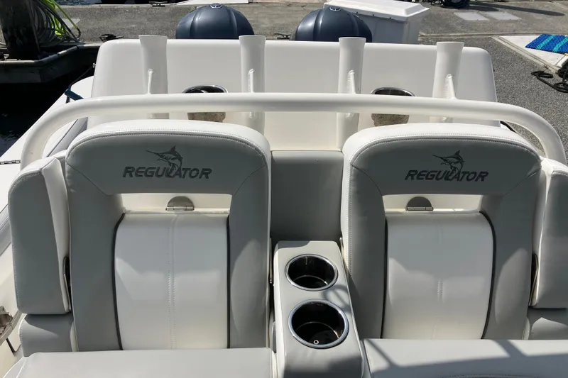  Yacht Photos Pics 2020 Regulator 31 boat seats with logo, featuring dual cup holders.