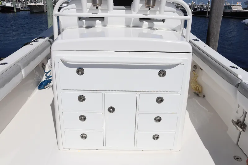  Yacht Photos Pics 2020 Regulator 31 boat interior with white storage drawers and ocean background.