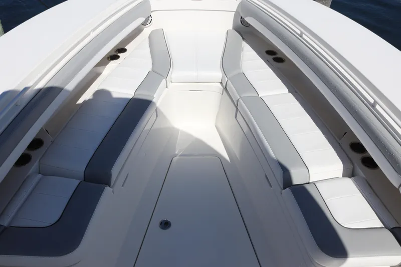  Yacht Photos Pics 2020 Regulator 31 boat interior with white and gray seating arrangement.