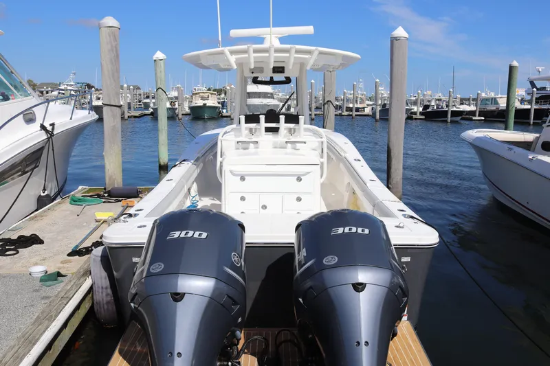  Yacht Photos Pics 2020 Regulator 31 boat with dual 300 horsepower engines docked at marina.