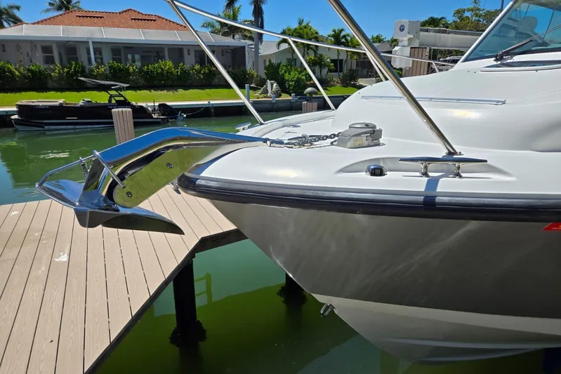  Yacht Photos Pics 2016 Boston Whaler 315 Conquest boat anchored at a dock, sunny day.