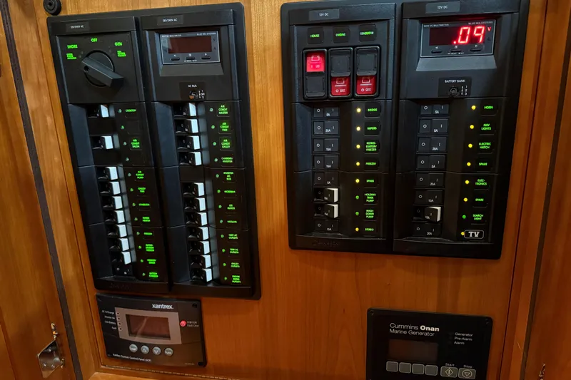 Oyster Yacht Photos Pics Electrical control panel on 2018 Sabre 48 Salon Express yacht, featuring switches and displays.