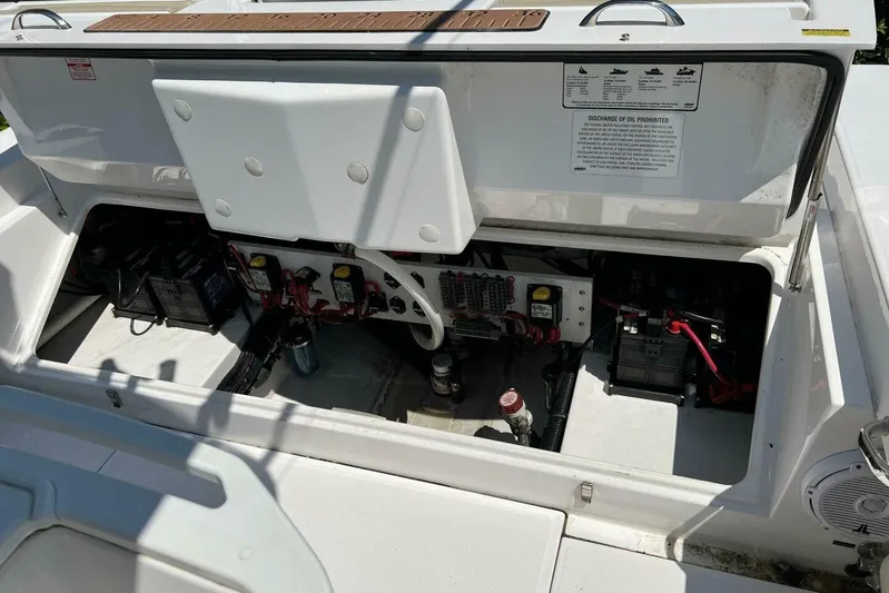  Yacht Photos Pics 2019 Everglades 273 Center Console boat electrical compartment with batteries and wiring.
