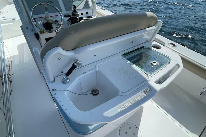  Yacht Photos Pics 2019 Everglades 273 Center Console boat with helm and seating, on open water.