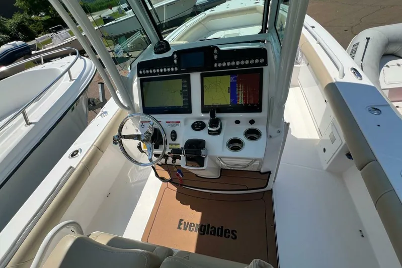  Yacht Photos Pics 2019 Everglades 273 Center Console boat cockpit with dual navigation screens and steering wheel.