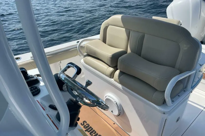  Yacht Photos Pics 2019 Everglades 273 Center Console boat interior with steering wheel and seating.