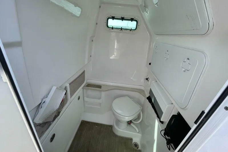  Yacht Photos Pics Interior of 2019 Everglades 273 Center Console boat with compact marine toilet.