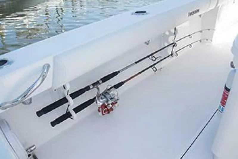 Yacht Photos Pics 2019 Everglades 273 Center Console boat with fishing rods secured on deck.