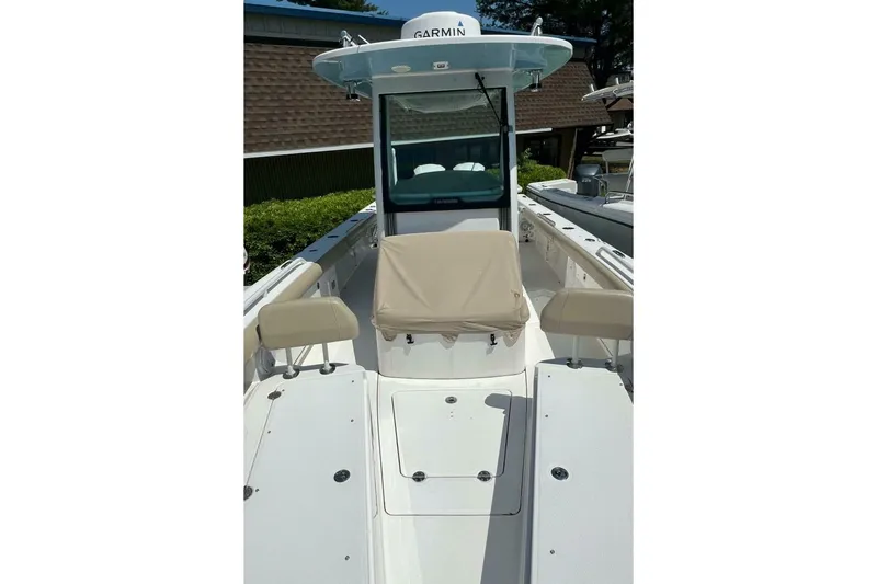  Yacht Photos Pics 2019 Everglades 273 Center Console boat with Garmin equipment, beige seating, and spacious deck.