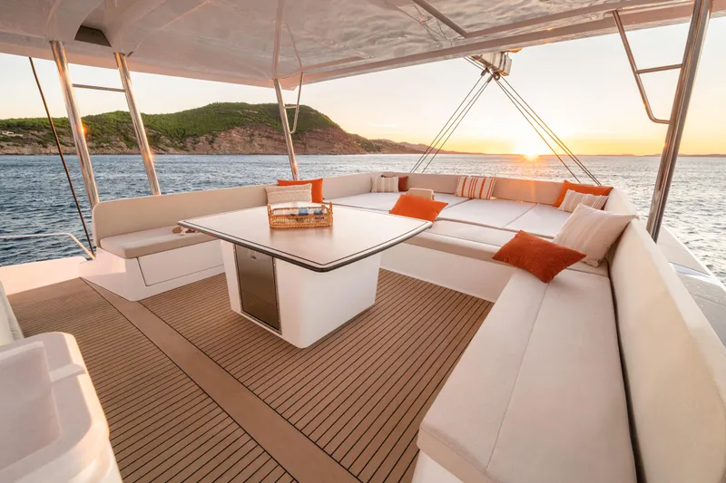  Yacht Photos Pics Luxurious Bali 5.8 yacht deck with sunset view, featuring comfortable seating and elegant design, 2026 model.