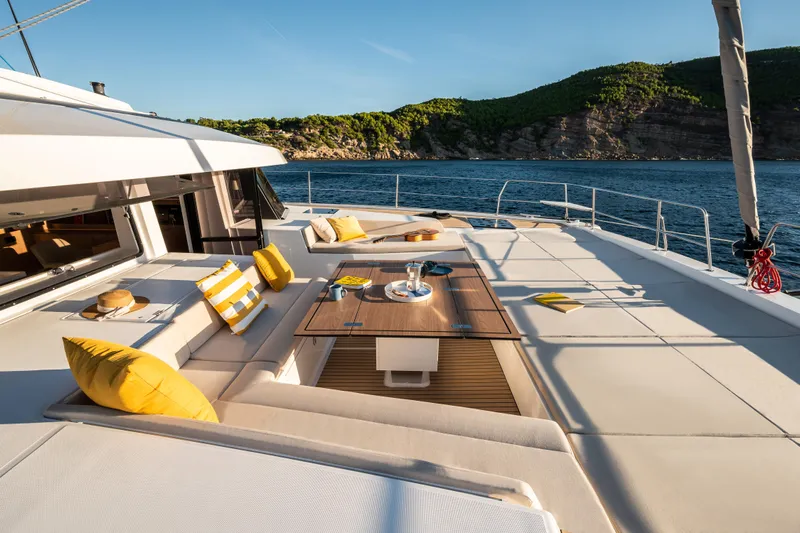  Yacht Photos Pics Luxurious Bali 5.8 yacht deck with seating, table, and ocean view, 2026 model.