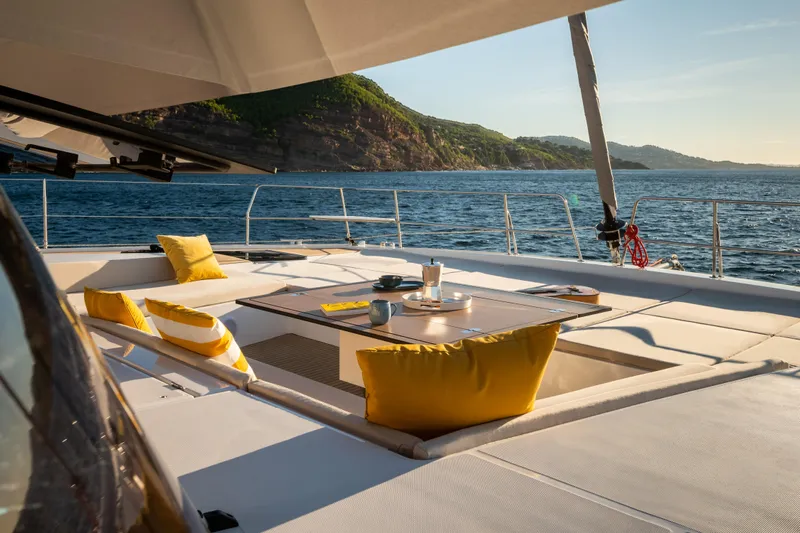  Yacht Photos Pics Luxurious Bali 5.8 yacht deck with yellow cushions, ocean view, 2026 model.