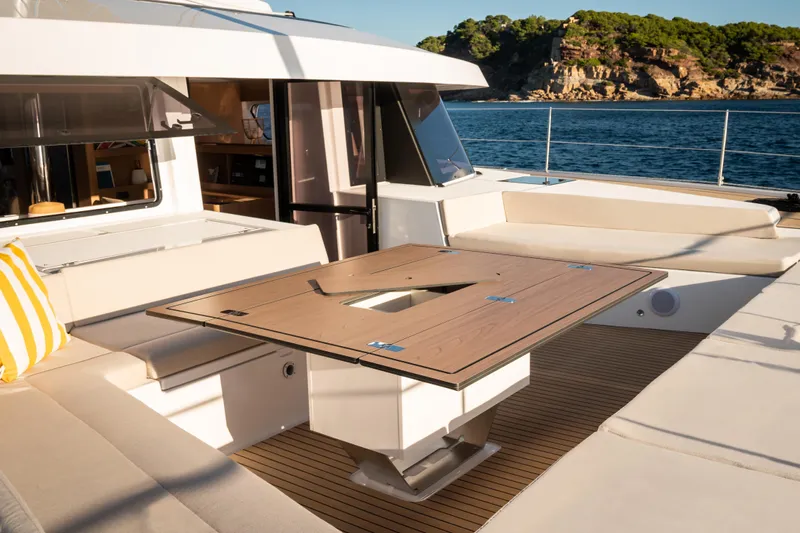  Yacht Photos Pics Luxurious Bali 5.8 yacht deck with seating and table, 2026 model, ocean view.