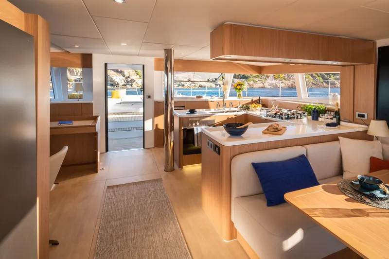  Yacht Photos Pics Luxurious interior of 2026 Bali 5.8 yacht with modern kitchen and seating area.