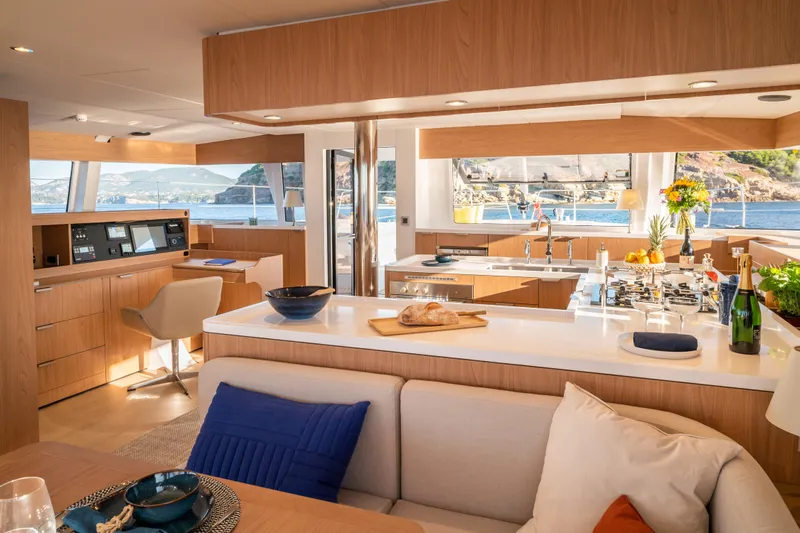  Yacht Photos Pics Luxurious interior of 2026 Bali 5.8 yacht with modern kitchen and scenic ocean view.
