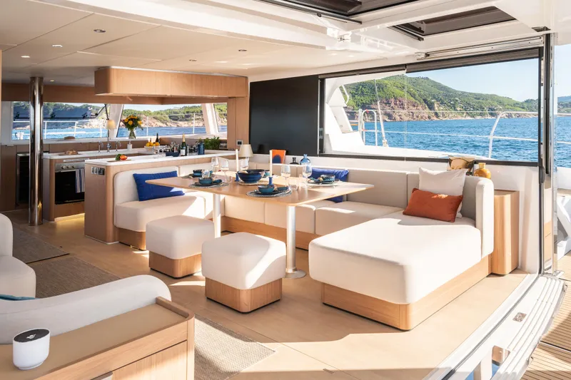  Yacht Photos Pics Luxurious interior of 2026 Bali 5.8 yacht with elegant dining area and scenic ocean view.