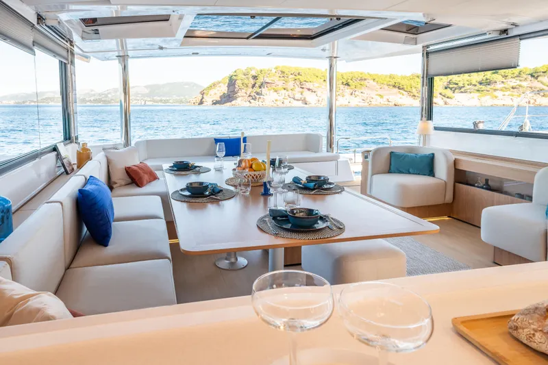  Yacht Photos Pics Luxurious interior of 2026 Bali 5.8 yacht with elegant dining area and ocean view.