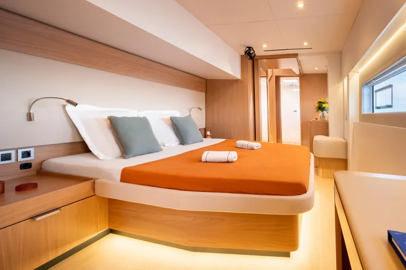  Yacht Photos Pics Luxurious cabin interior of 2026 Bali 5.8 yacht with modern design and cozy bedding.