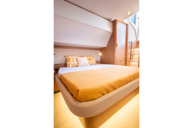  Yacht Photos Pics Luxurious cabin interior of 2026 Bali 5.8 yacht with modern design and cozy bedding.