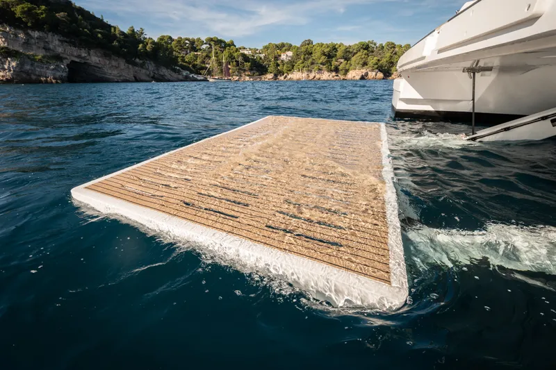  Yacht Photos Pics Floating platform attached to a Bali 5.8 yacht, 2026 model, in scenic coastal waters.